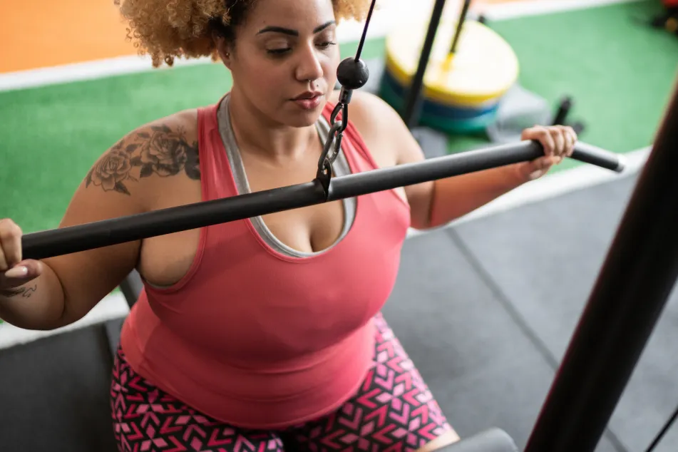 photo of woman pulling weight