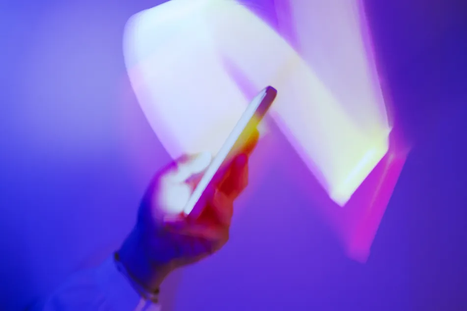 photo of using smartphone on holographic 