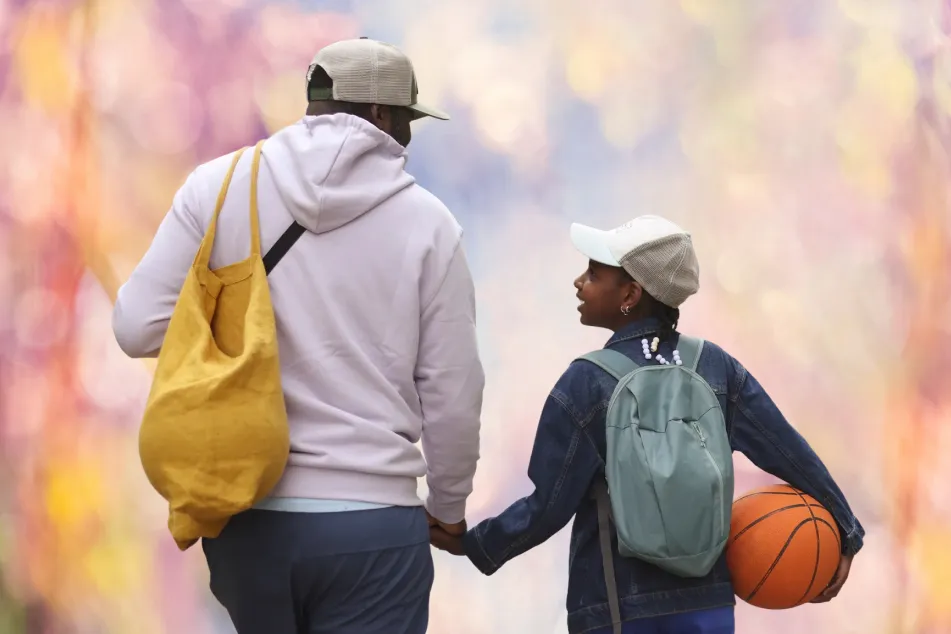 photo of father and his daughter on their way 