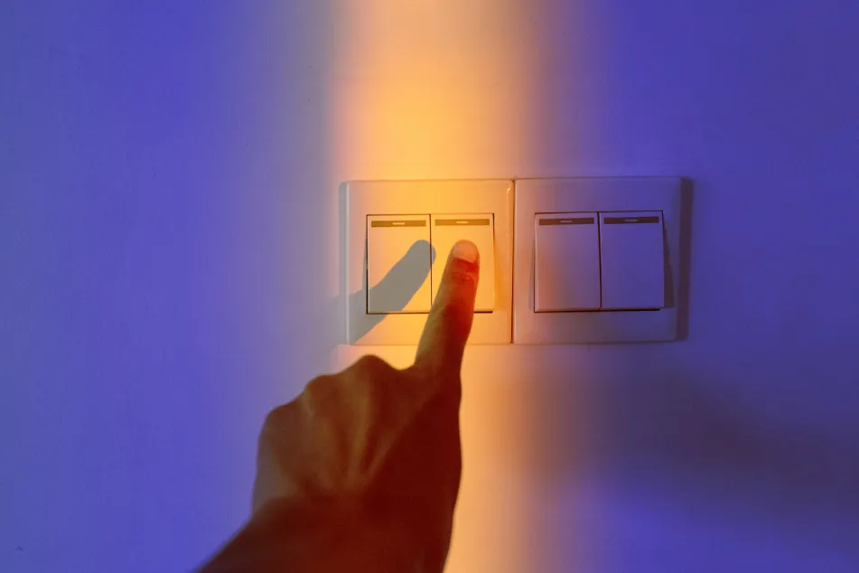 photo of Hands touching a control panel